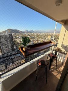 a balcony with a view of a city at Ivan Suite More than accommodation an experience in Santiago