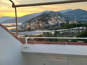 a view of a city from a balcony at Casa Giardino Vista Mare in Ventimiglia +10 photos