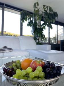 a bowl of fruit sitting on a table at The London Skyline Penthouse in London