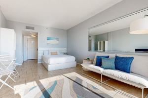 a living room with a couch and a bed at Pirates Bay B314 in Fort Walton Beach