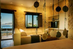 A television and/or entertainment centre at Exensian Villas & Suites