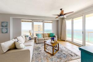 a living room with a couch and a table at Seychelles Beach Resort 2001 in Panama City Beach