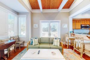 a living room with a couch and a table at Sunshine Haven in Carrabelle