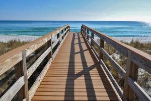 a wooden boardwalk leading to the beach at Inn at Summerwind 0602 in Navarre