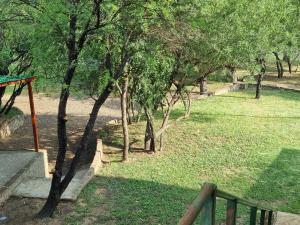 a view of a park with trees and grass at Bloemhof Riverside Chalets in Bloemhof +2 photos