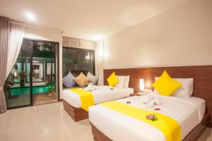 Säng eller sängar i ett rum på Katerina Pool Villa Resort Phuket