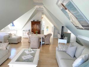 a living room with a couch and a table at Haus Anholt in Timmendorfer Strand