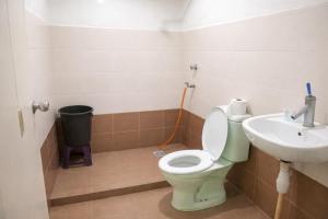 a bathroom with a toilet and a sink at JAA Homes 1-8 Pax Family Stay Jalan UMS KK in Kota Kinabalu +15 photos