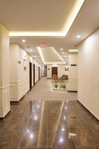 an empty hallway in a office building with a lobby at RT Serene Hotel - Larkana in Lāhori
