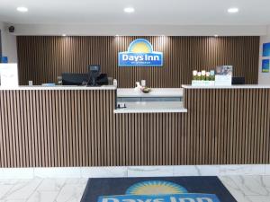 a pay aid counter in an airport lobby at Days Inn by Wyndham Effingham in Effingham