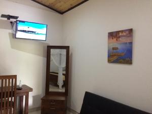 A television and/or entertainment centre at GG Lodge Mirissa