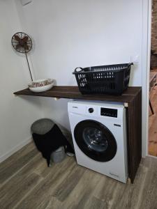 a washing machine with a basket on top of it at Aigues-Vives Appartement in Aigues-Vives +3 photos