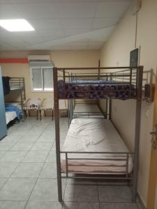 a bedroom with two bunk beds in a room at Tenerife Hostel in Los Cristianos