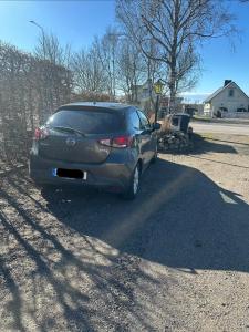 a car parked on the side of a road at Studio Kustvägen in Mellbystrand