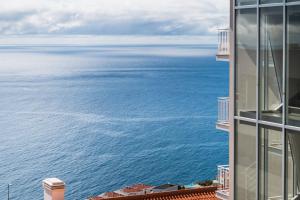 a view of the ocean from a building at GuestReady - Charming Apartment with Ocean Views in Caniço
