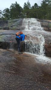 a man standing in front of a waterfall at Chalet Vradal in Vradal +79 photos