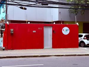 a red wall on the side of a street at STAY POUSADA in Recife