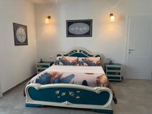 a bedroom with a bed and two night stands at Casa della Cittadella in Noto