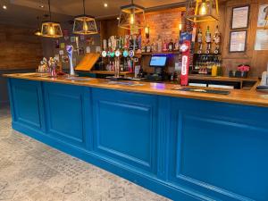 a blue bar in a pub with a blue counter at The Victoria Bar & Hotel in Wakefield