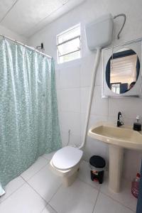 a bathroom with a toilet and a sink at Sonho de Minas Hospedaria in Ouro Preto +20 photos