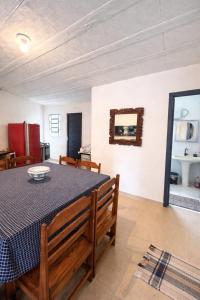a dining room with a table and a mirror at Sonho de Minas Hospedaria in Ouro Preto