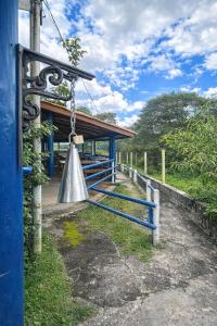 a bell hanging from a chain in front of a building at Sonho de Minas Hospedaria in Ouro Preto