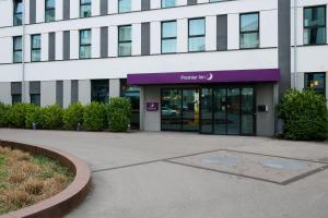 a building with a purple sign in front of it at Premier Inn Freiburg City Nord in Freiburg im Breisgau