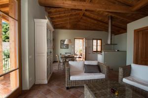 a living room with a couch and a table at VillaLimone in Limone sul Garda