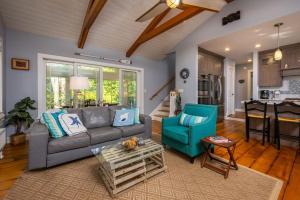 a living room with a gray couch and a blue chair at Colonels Quarters in Kennebunk