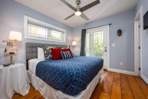 a bedroom with a bed and a ceiling fan at Colonels Quarters in Kennebunk
