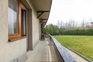 a balcony of a building with a view of a field at HARMONY Apart in Truskavets