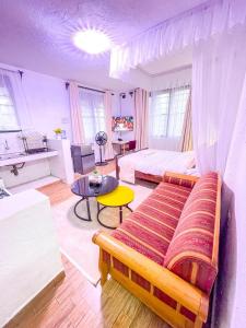 a bedroom with a bed and a table in it at R 19 Kogelo Villas in Kisumu