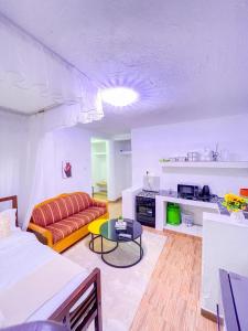 a living room with a couch and a table at R 19 Kogelo Villas in Kisumu