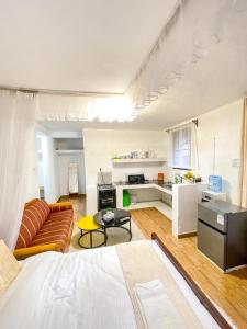 a large living room with a couch and a table at R 19 Kogelo Villas in Kisumu