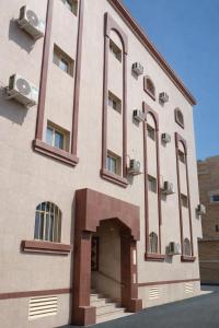 a large building with a door in front of it at رولارا بلازا in Medina