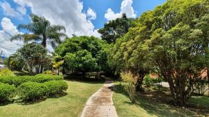 a path through a park with trees and grass at SPA BOA VISTA - Refugio in Itatiba