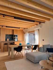 a living room with a table and a couch at Doniños Nature in A Coruña