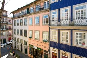 a group of buildings on a city street at Braganca Oporto in Porto