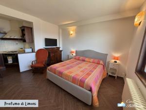 a bedroom with a bed and a living room at Casa Bellavista in Bergeggi
