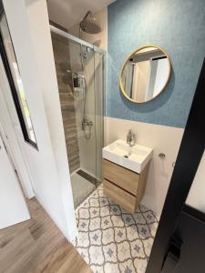 a bathroom with a sink and a mirror at Lively Sopela House by Kima Gestíon in Sopelana +29 photos