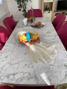 a table with a white marble counter top at Camping La Ozan in Petreştii de Jos