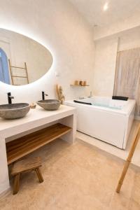 a bathroom with two sinks and a tub at MEEY Suite with Private Spa in Saint-Étienne +7 photos