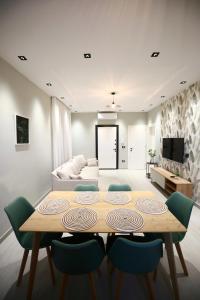 a living room with a table and chairs and a couch at Julis Villa in Draç