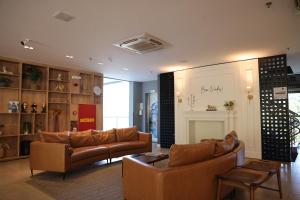a living room with two couches and a table at Grand Suítes Family Resort in Itá +56 photos