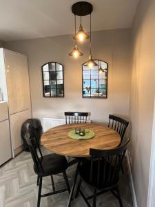 a dining room with a wooden table and chairs at The Ferry Loft Montrose in Montrose