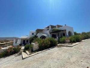 a house on the side of a road at Dejableu - Island Living Paros in Sarakíniko