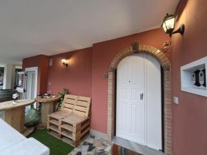 a room with a white door and a table at La Dimora delle Fate - SOFIA in Bagnoli Irpino +40 photos