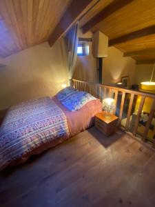 a bedroom with a bed on a balcony at La cabane de Thuriès in Camarès
