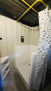 a room with a rock wall and a rappelling at Samui Camping Farm in Laem Sor