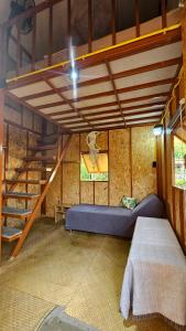 a room with a bunk bed and a staircase at Samui Camping Farm in Laem Sor